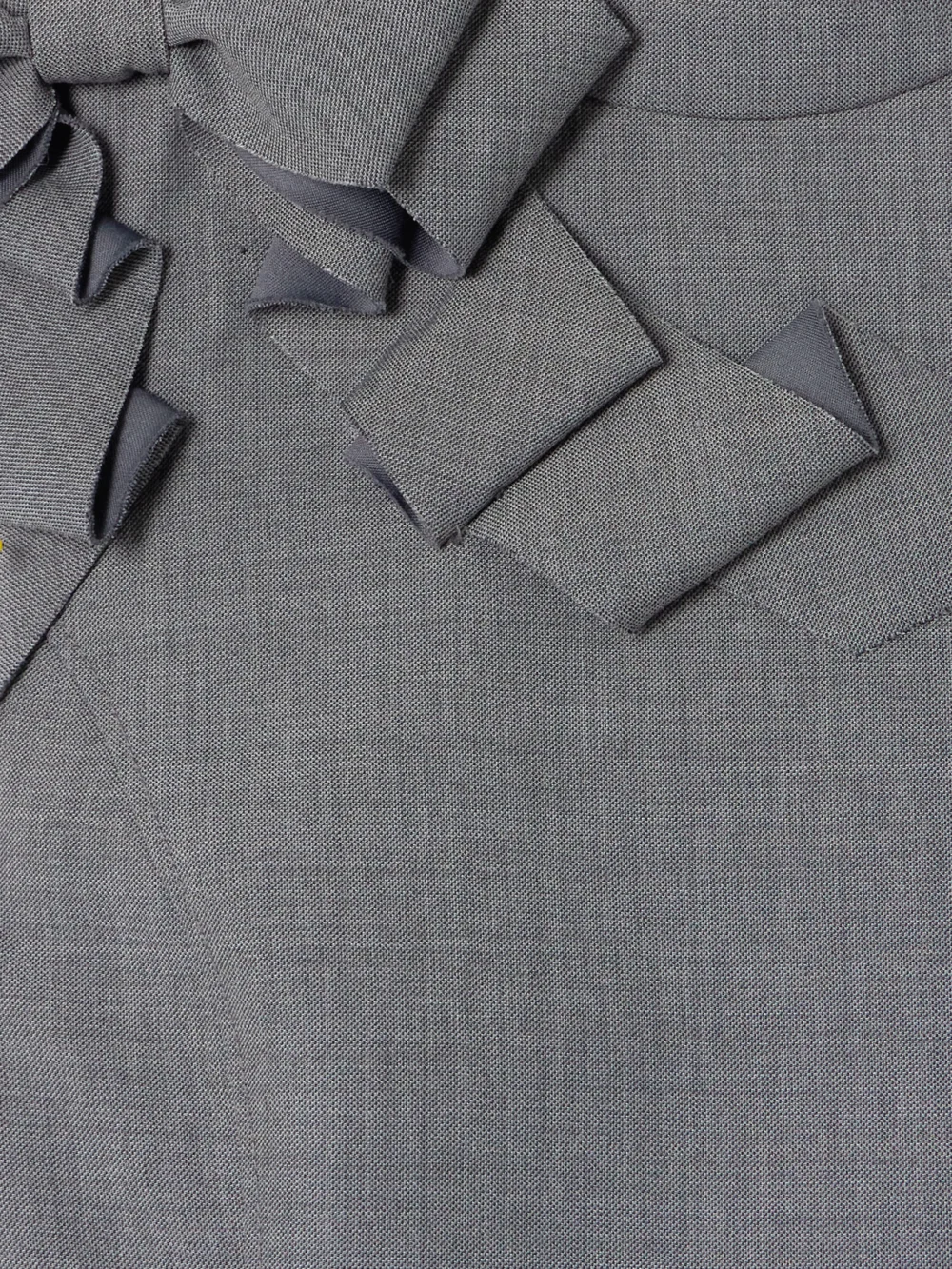 Close-up detail of the Shushu/Tong Bow-detailed Gathered Twill Mini Dress