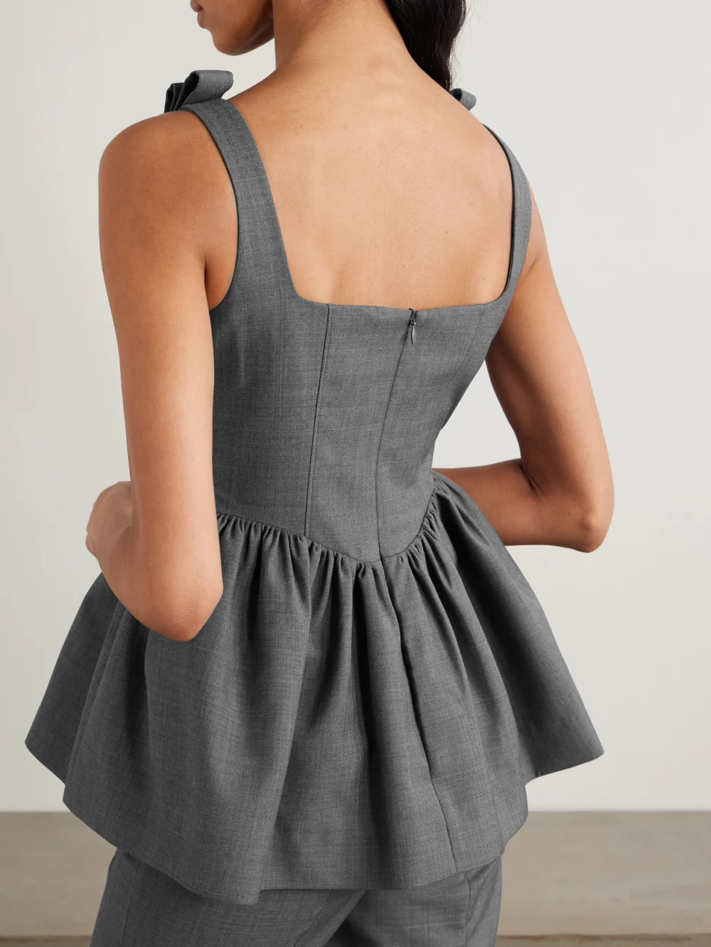 Back view of the Shushu/Tong Bow-detailed Woven Peplum Top