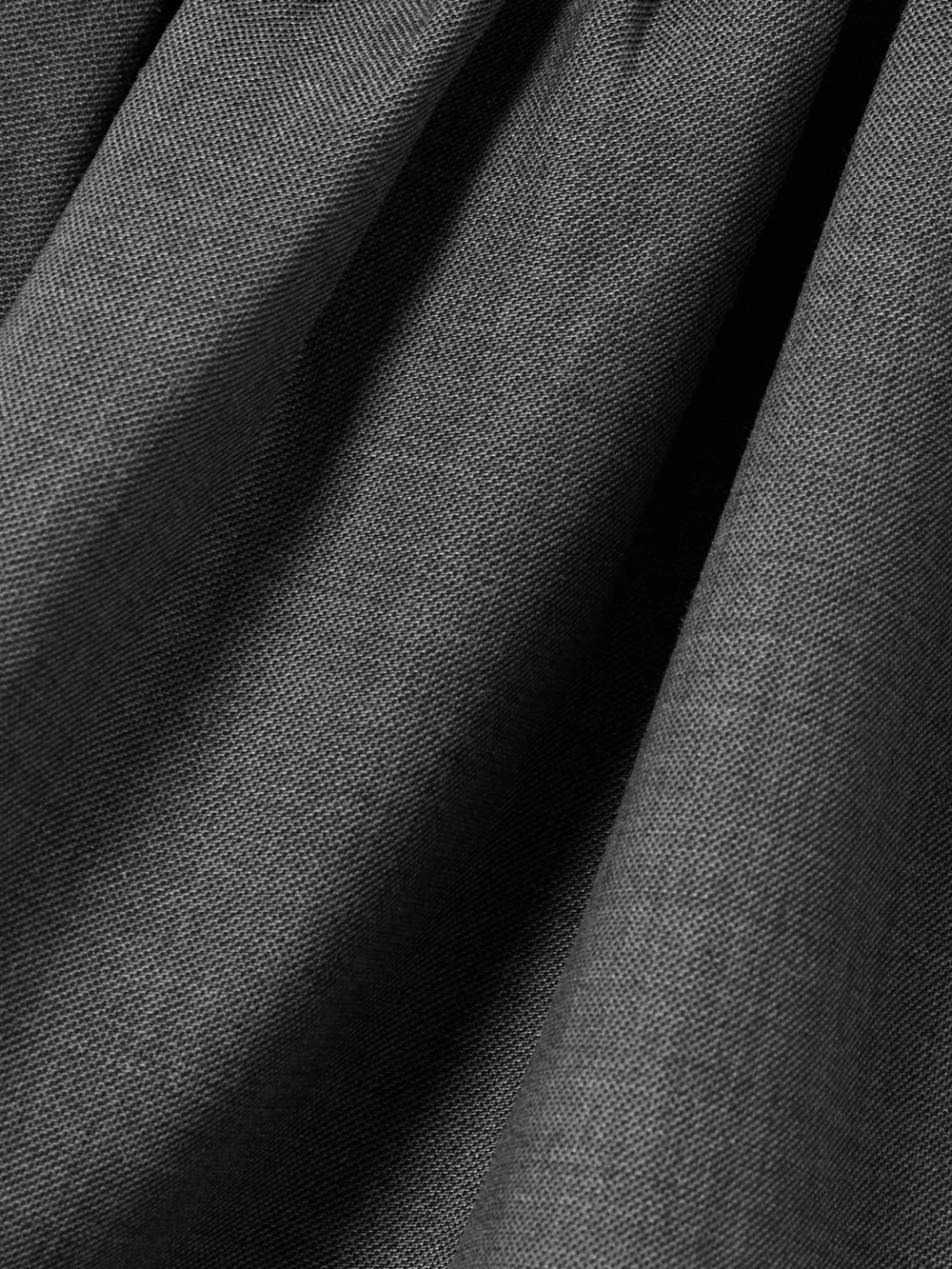 Close-up detail of the Shushu/Tong Bow-detailed Woven Peplum Top