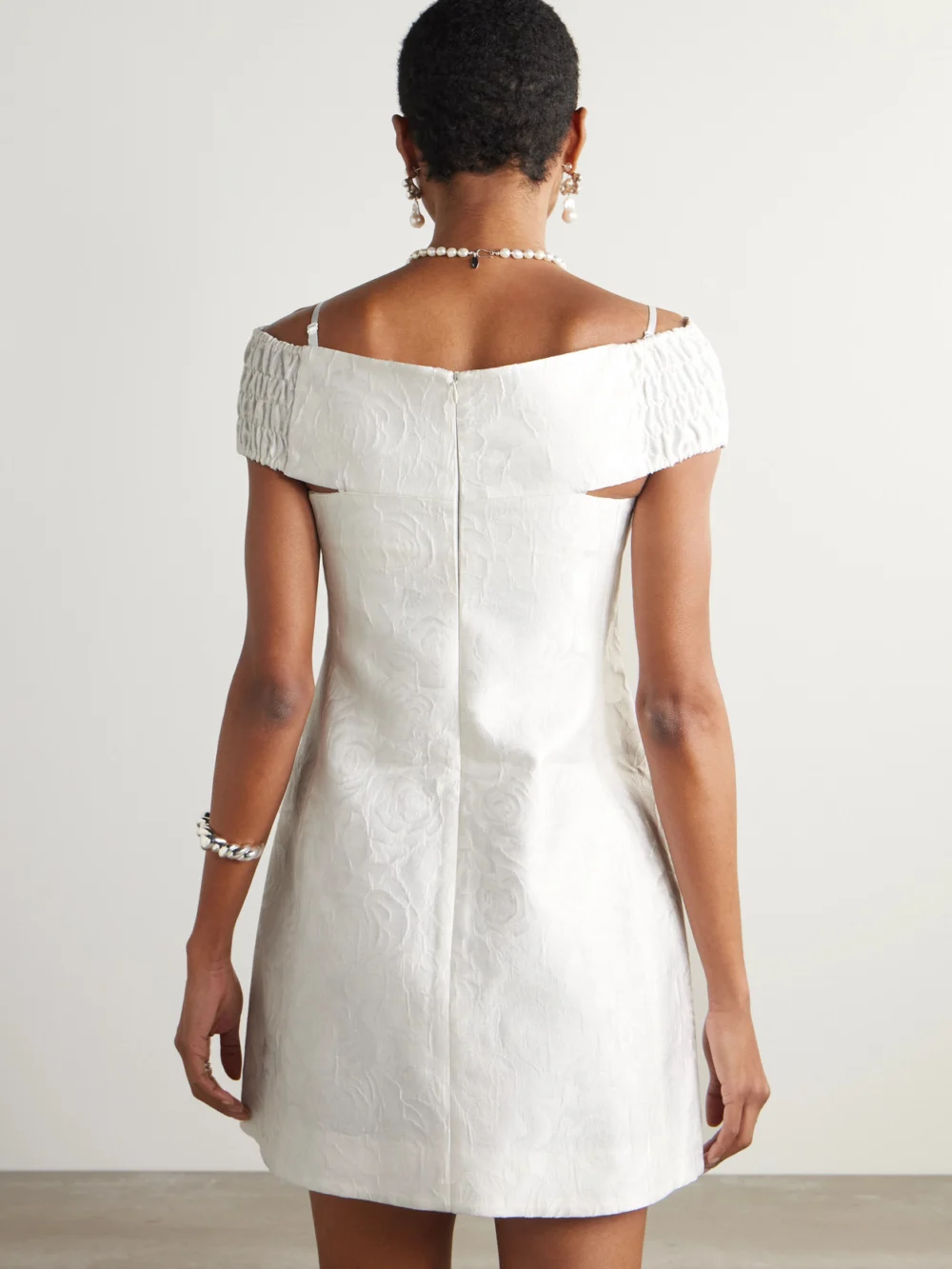 Back view of the Shushu/Tong Cold-shoulder Bow-embellished Jacquard Mini Dress