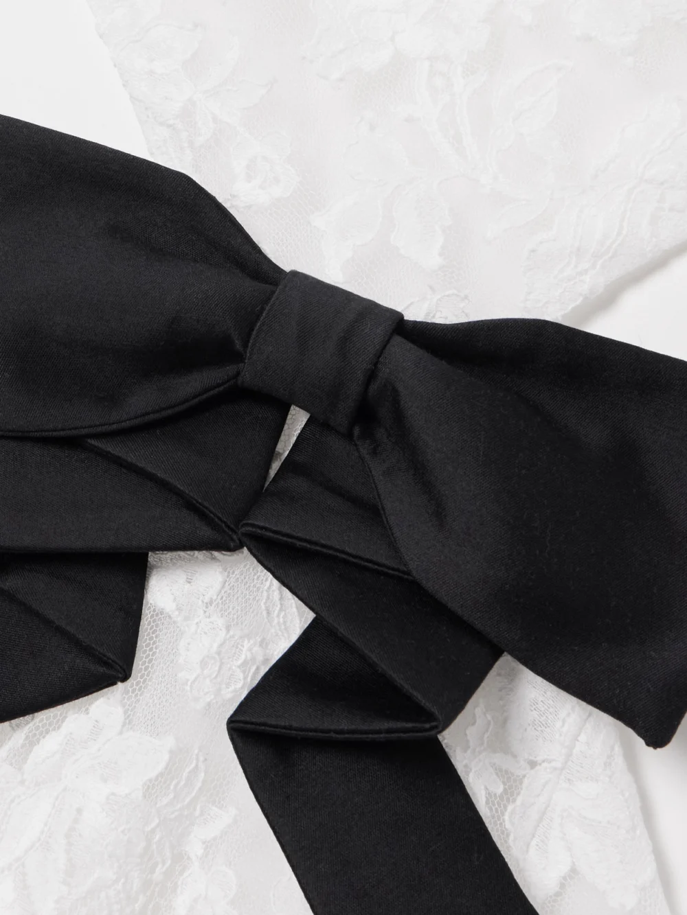 Close-up detail of the Shushu/Tong Cutout Bow-embellished Cotton-blend Lace Gown