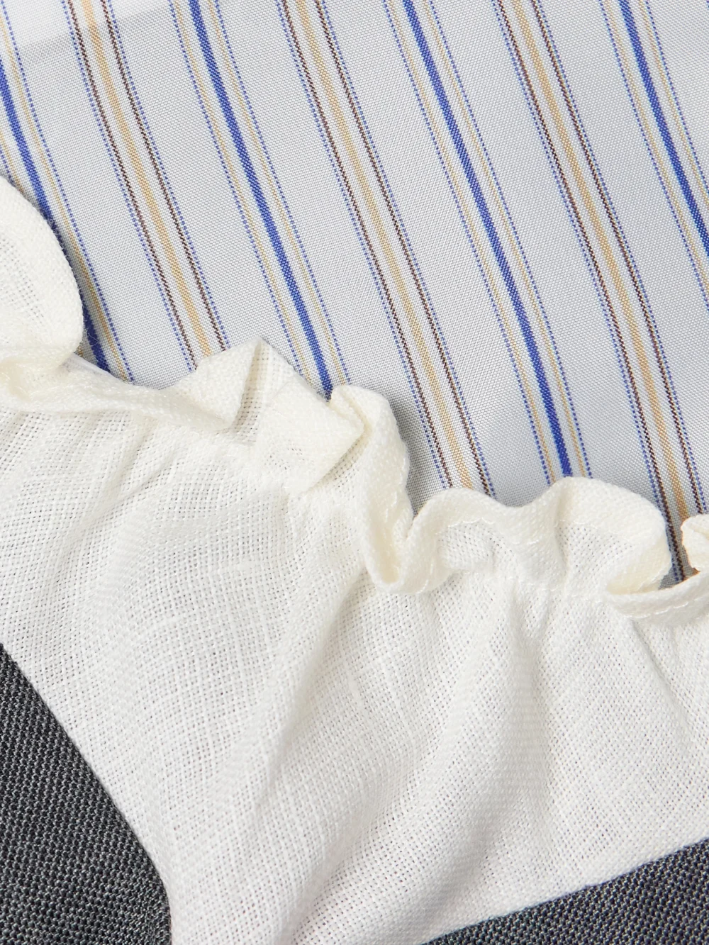Close-up detail of the Shushu/Tong Ruffled Wool-blend Gauze-trimmed Twill Mini Dress