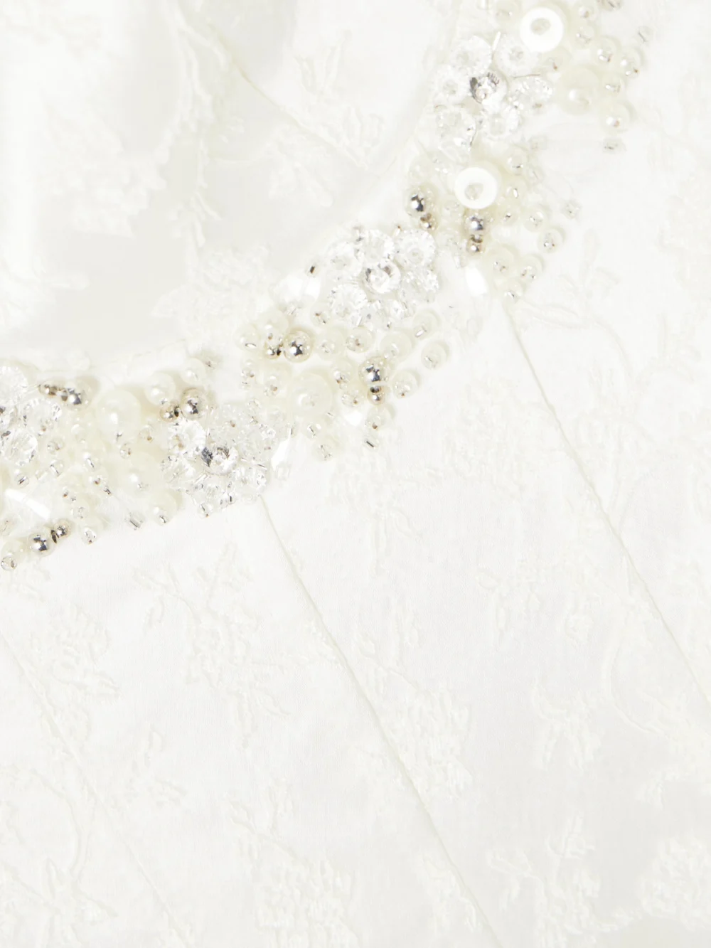 Close-up detail of the Simkhai Charlotte Embellished Pleated Satin-jacquard Midi Dress