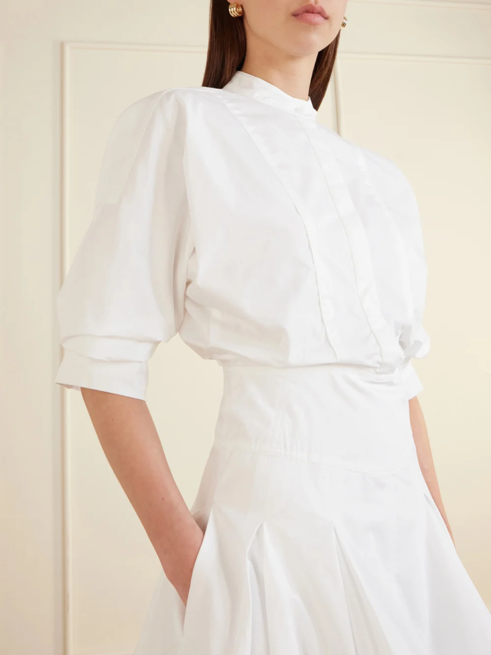 Close-up detail of the Simkhai Effie Bubble Pleated Cotton-blend Poplin Mini Dress