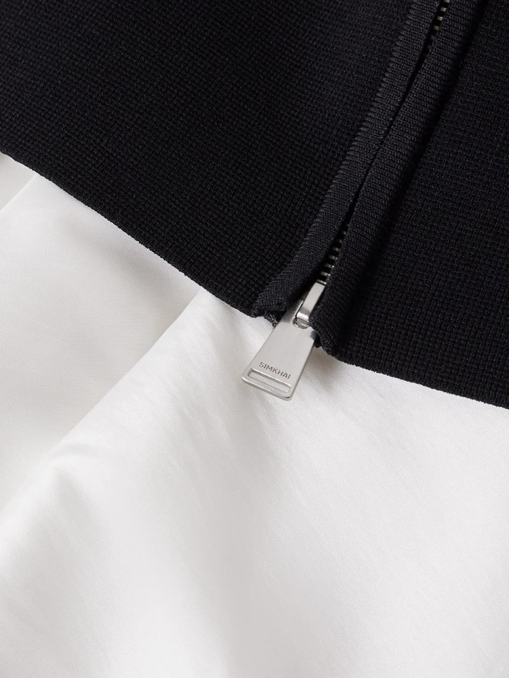 Close-up detail of the Simkhai Isabelle Ponte and Taffeta Midi Dress