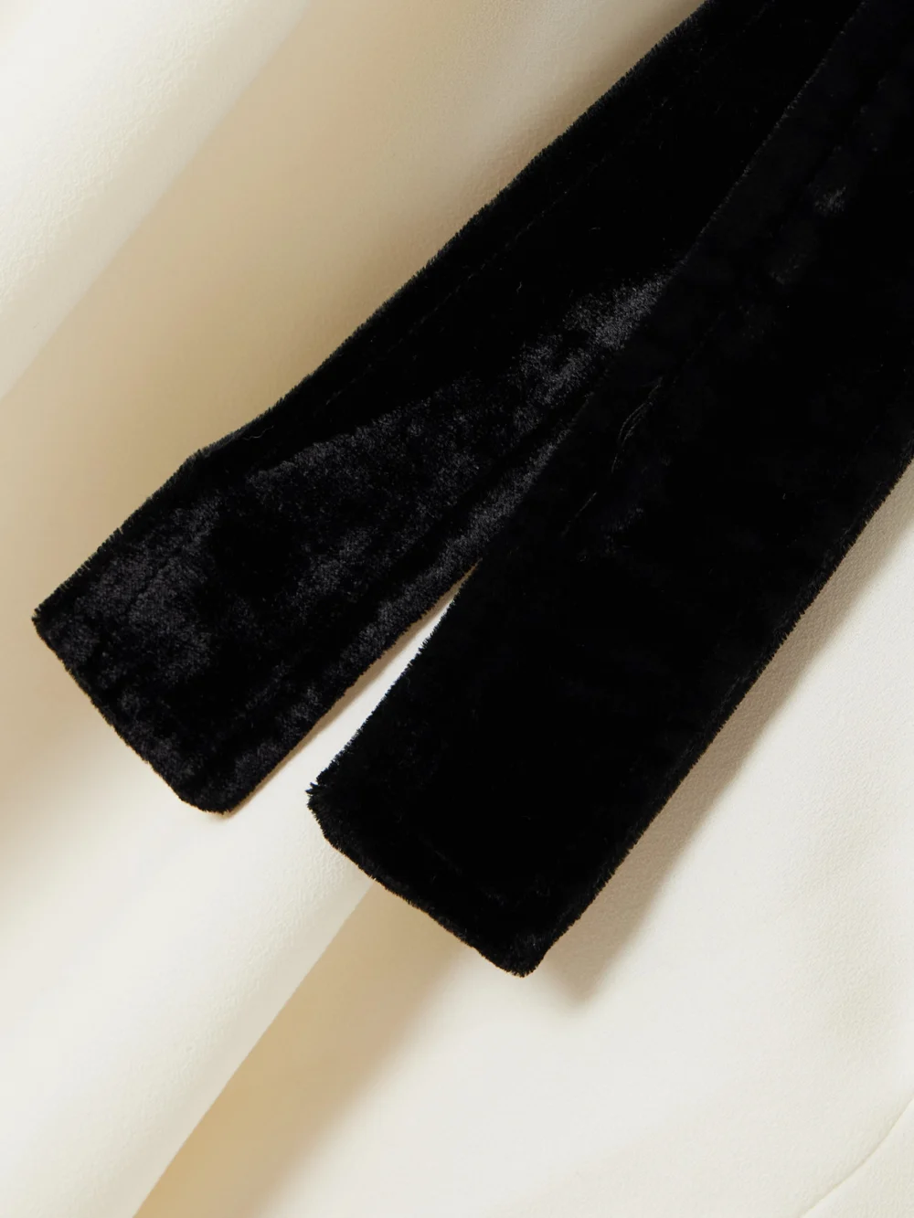 Close-up detail of the Simkhai Jolie Bow-detailed Velvet-trimmed Crepe Mini Dress