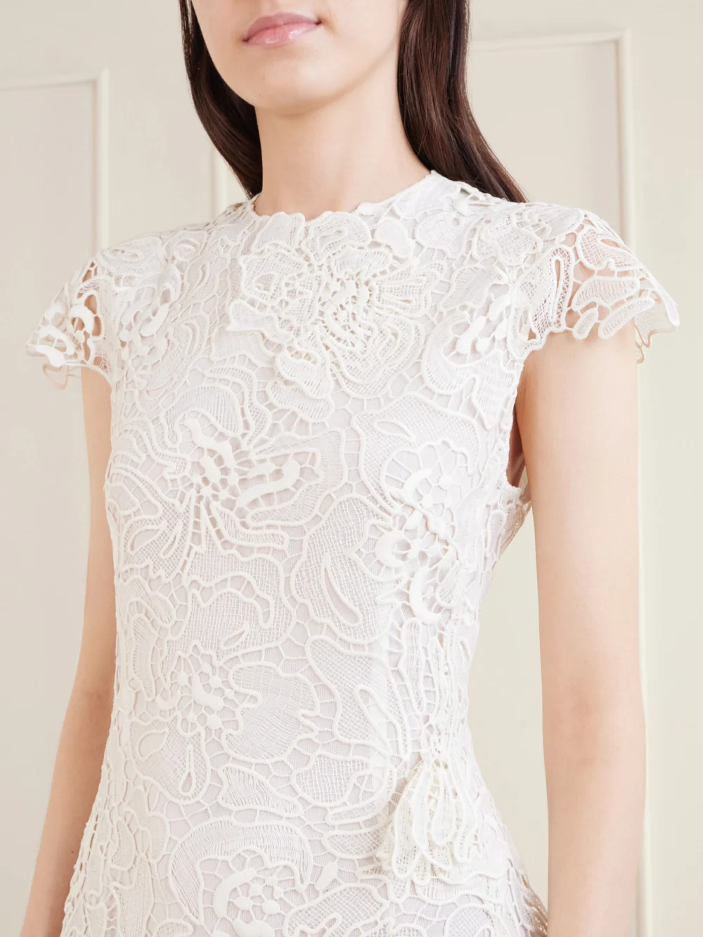 Close-up detail of the Simkhai Novelle Lace Mini Dress