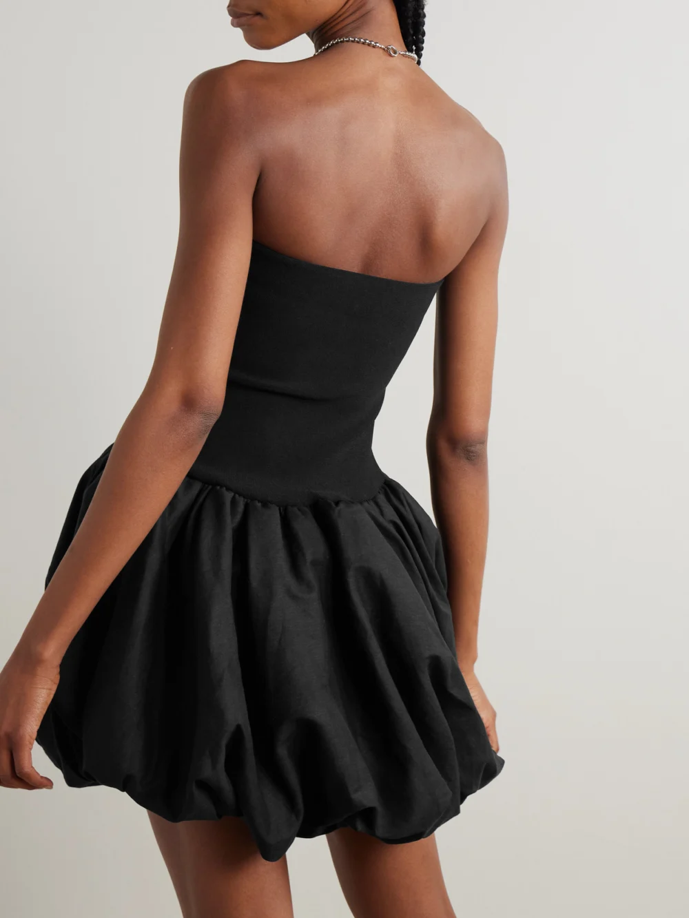 Back view of the Simkhai Pollie Strapless Stretch Recycled-knit and Linen-blend Mini Dress