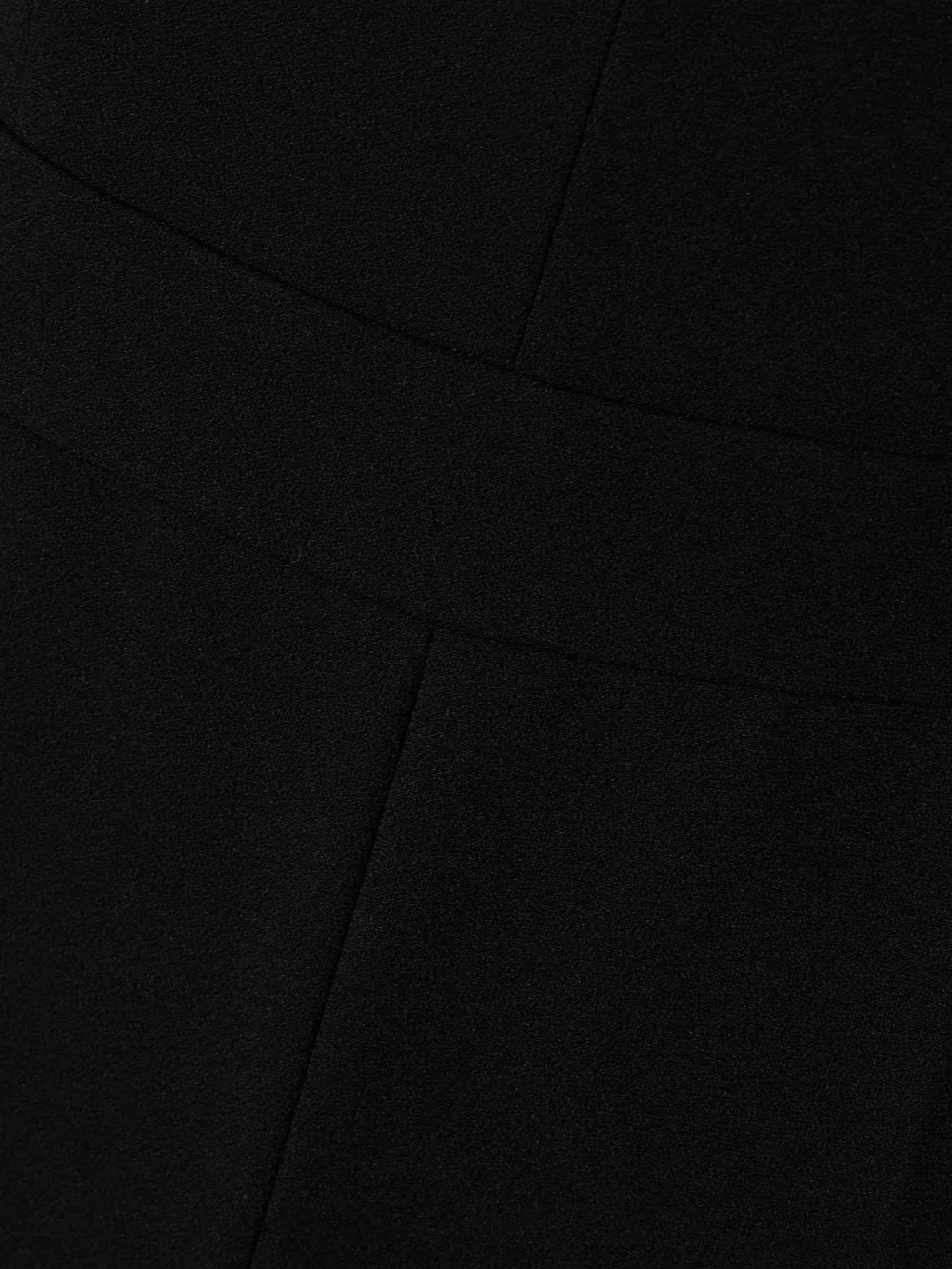 Close-up detail of the Simkhai Rhodes Paneled Crepe Jumpsuit