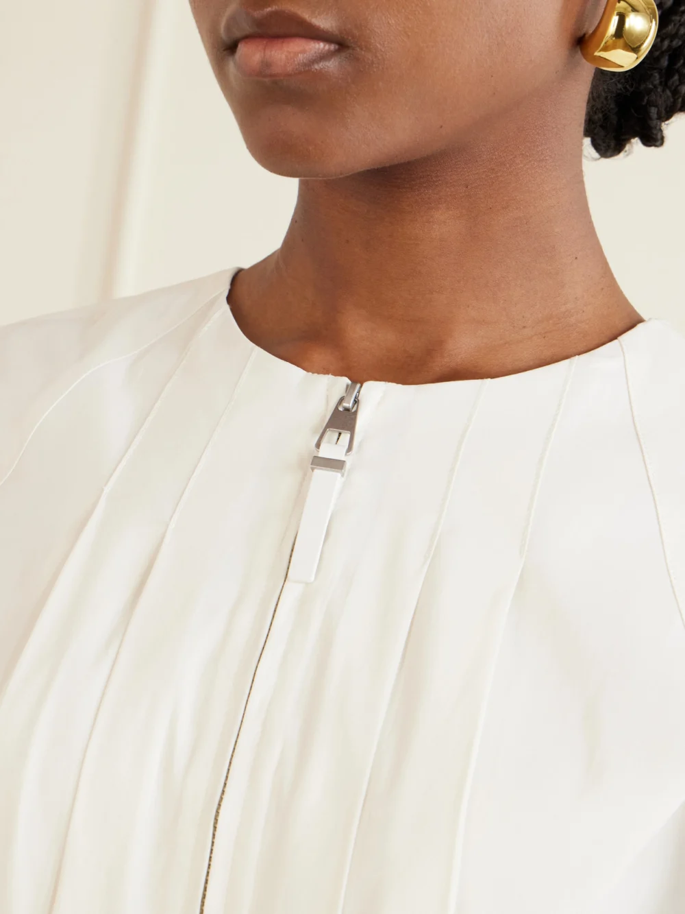 Close-up detail of the Simkhai Risel Pleated Poplin Mini Dress