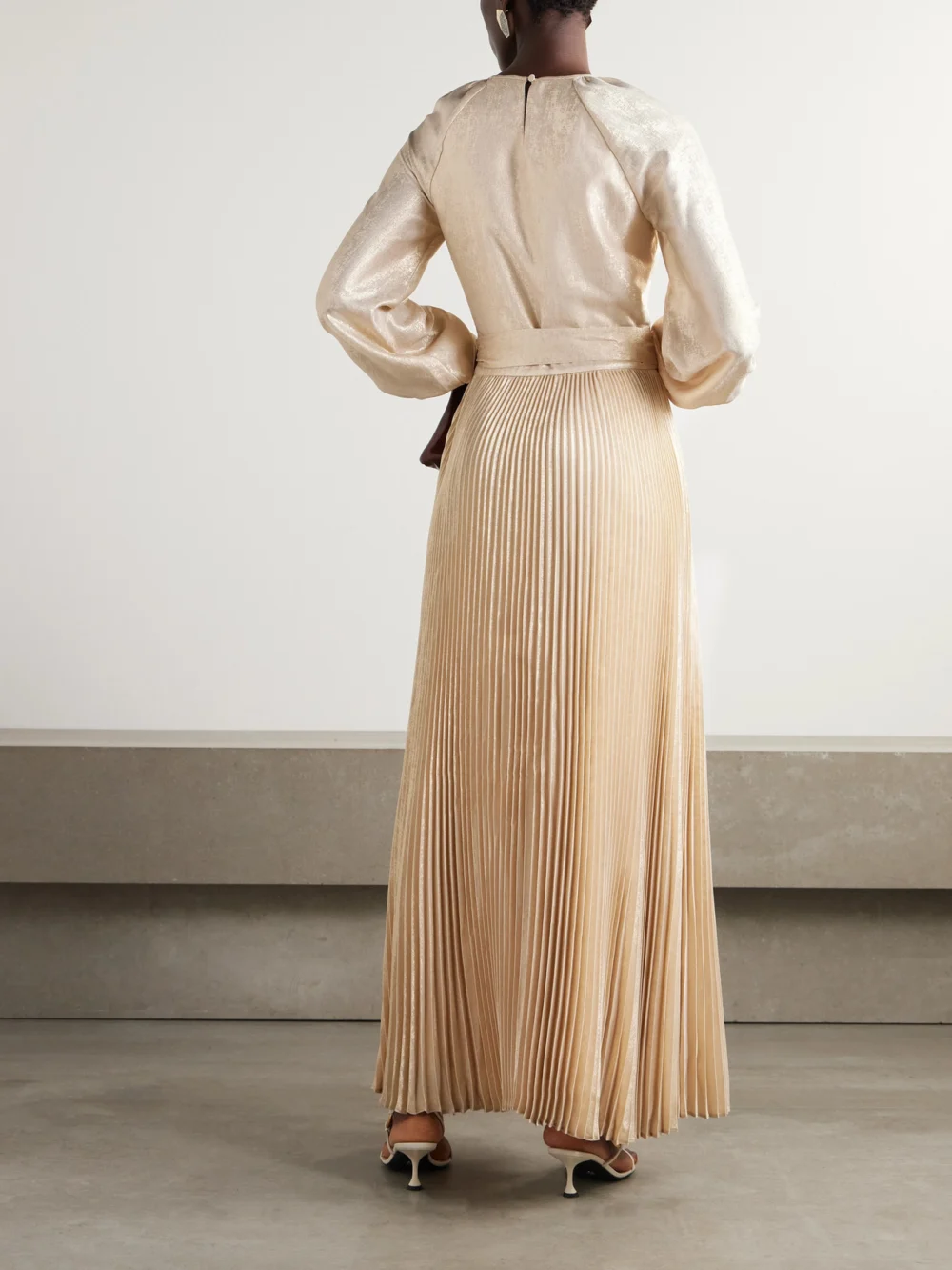 Back view of the Simkhai Varenya Belted Pleated Metallic Lamé Maxi Dress