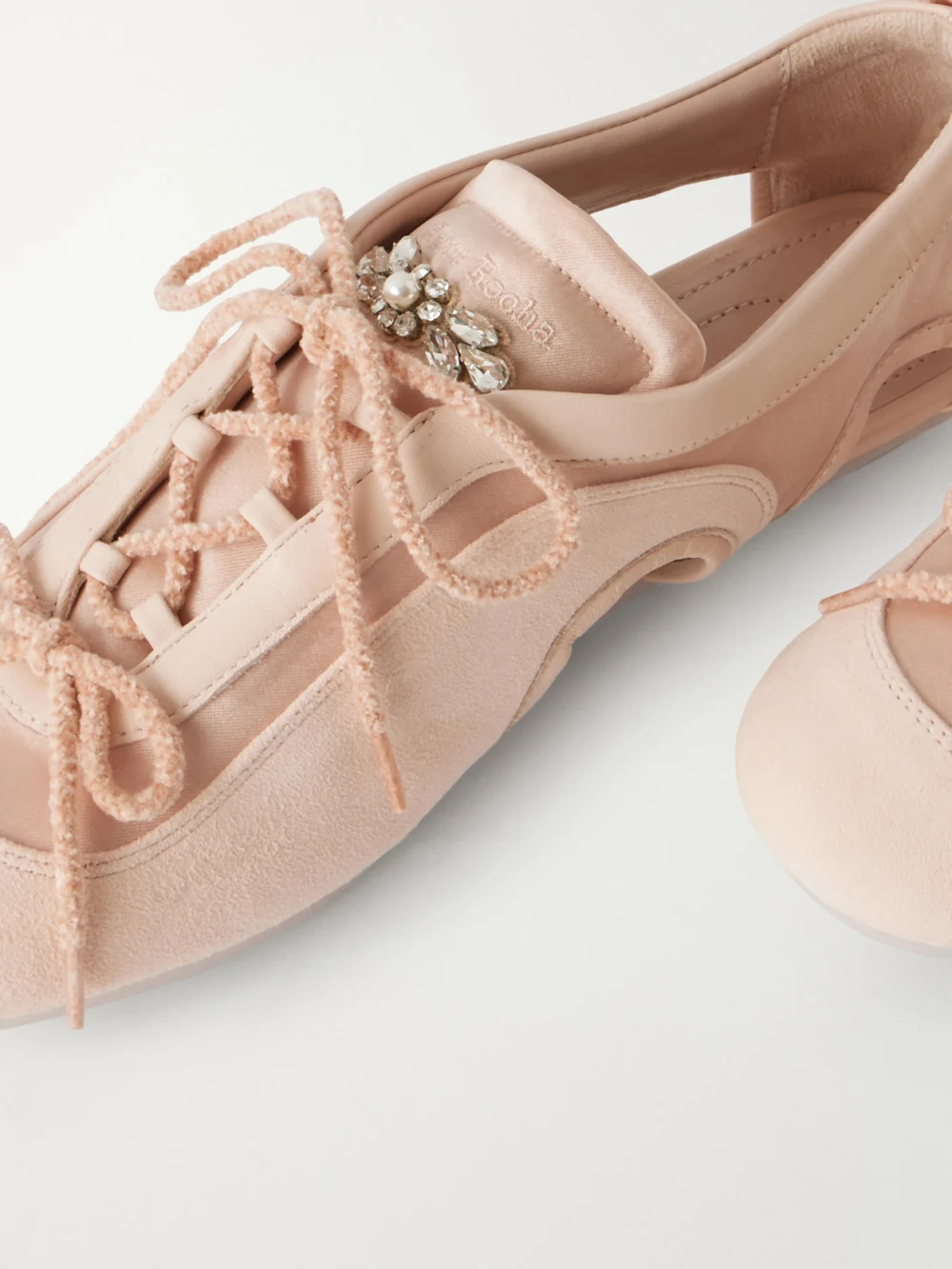 Close-up detail of the Simone Rocha Ballerina Cutout Suede-trimmed Satin Sneakers