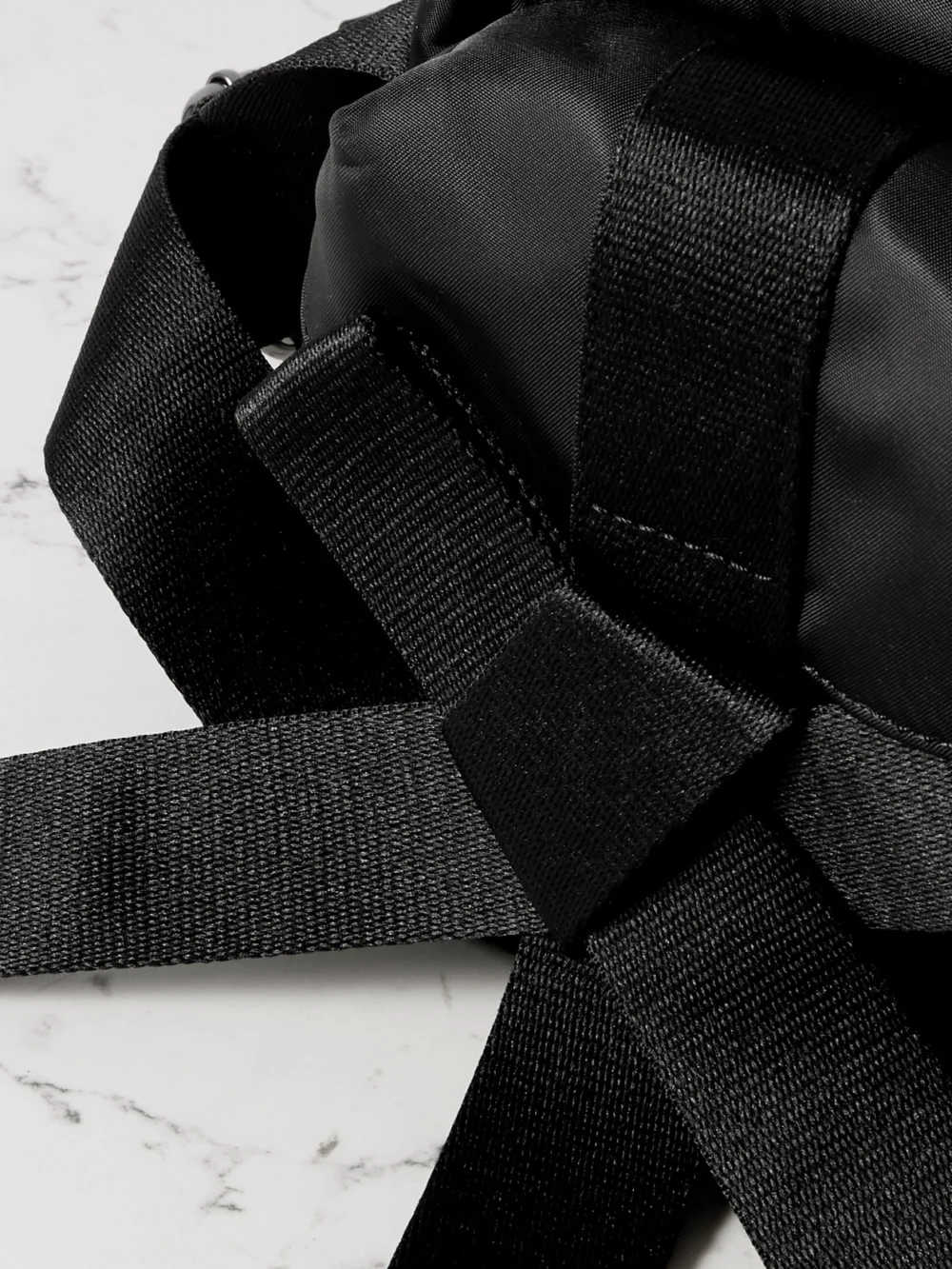 Close-up detail of the Simone Rocha Bow and Pearl-like Embellished Shell Belt Bag