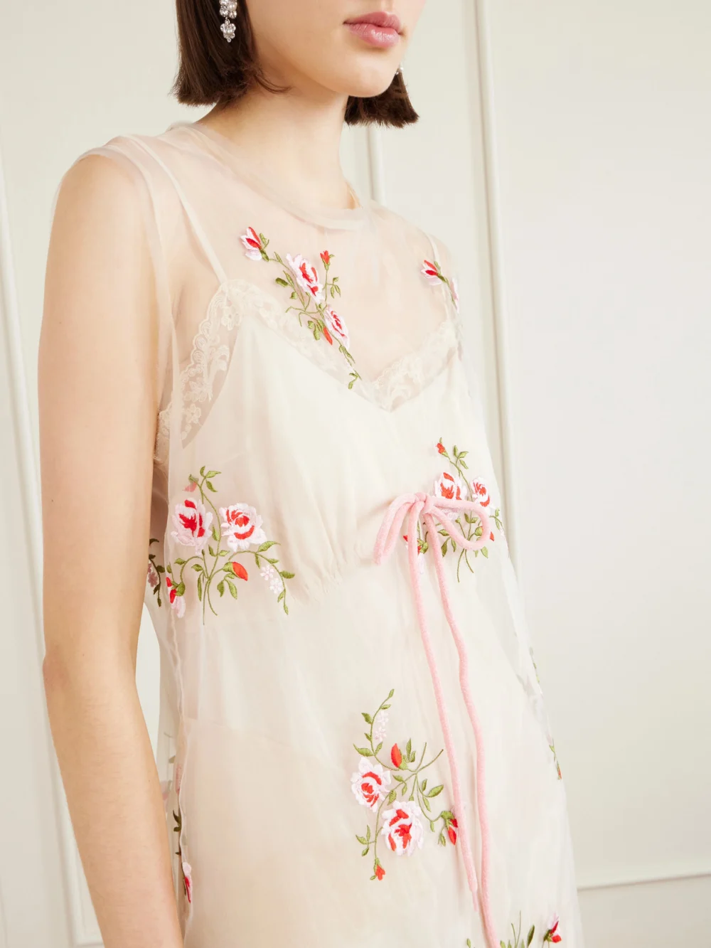 Close-up detail of the Simone Rocha Bow-embellished Embroidered Organza Midi Dress