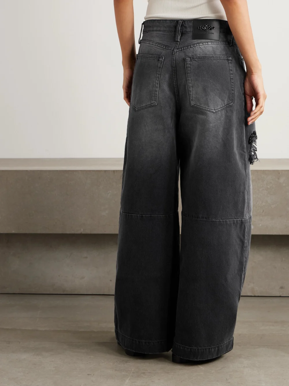 Back view of the Simone Rocha Crystal-embellished Distressed Wide-leg Jeans