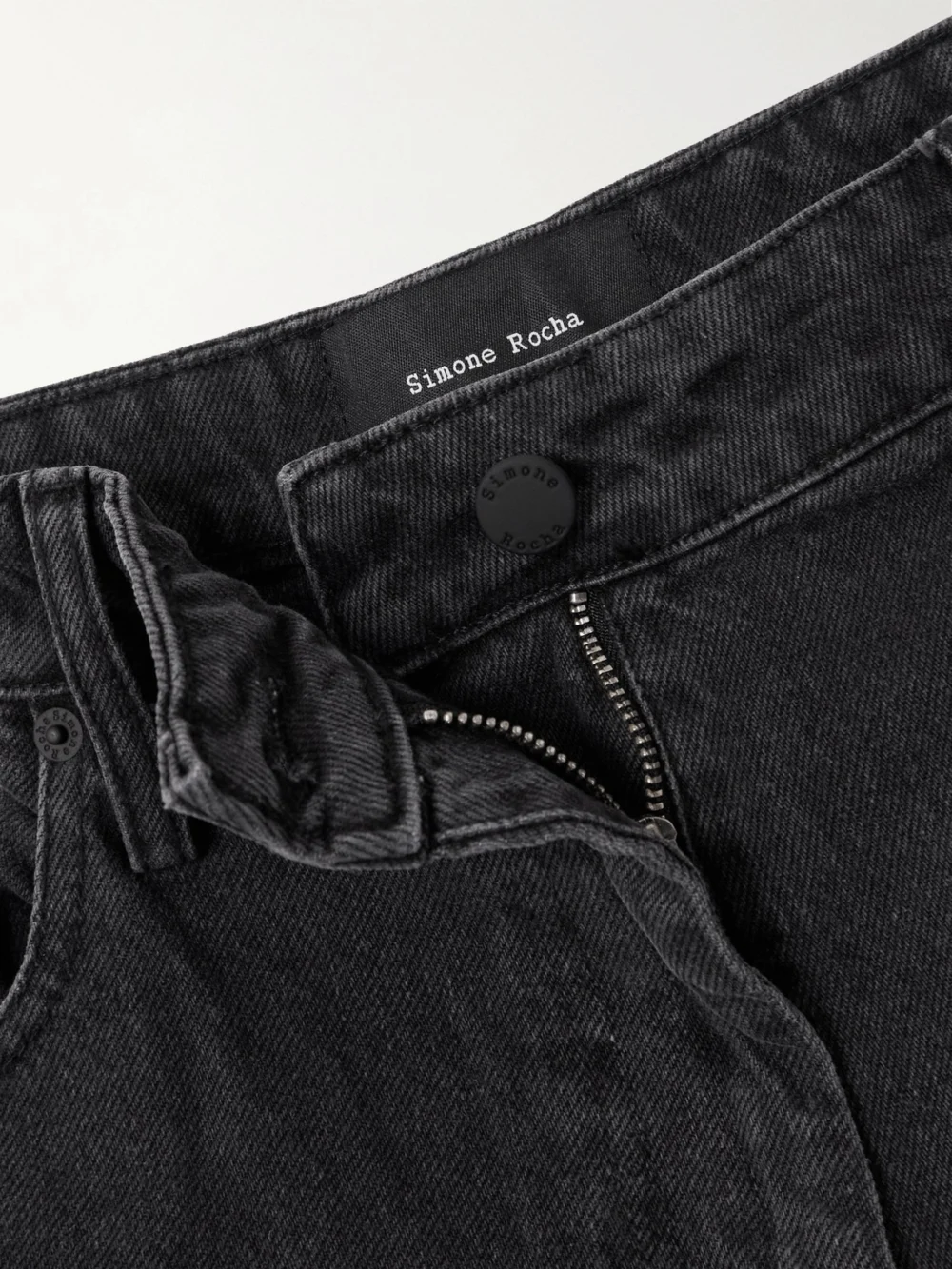 Close-up detail of the Simone Rocha Crystal-embellished Distressed Wide-leg Jeans