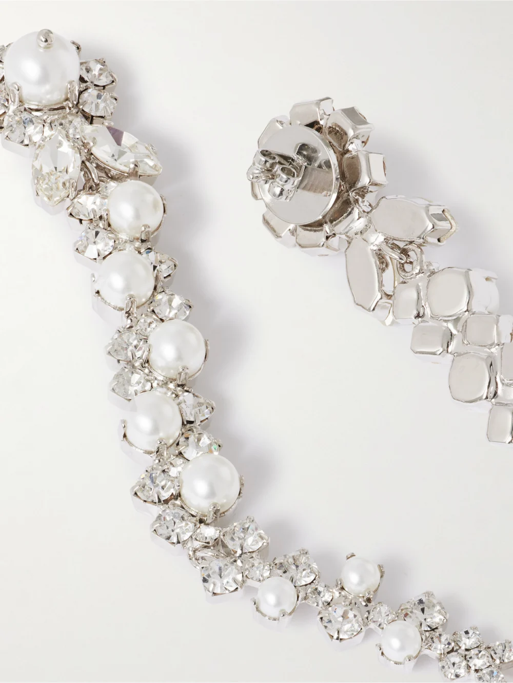 Close-up detail of the Simone Rocha Drip Silver-tone Crystal and Pearl-like Earrings