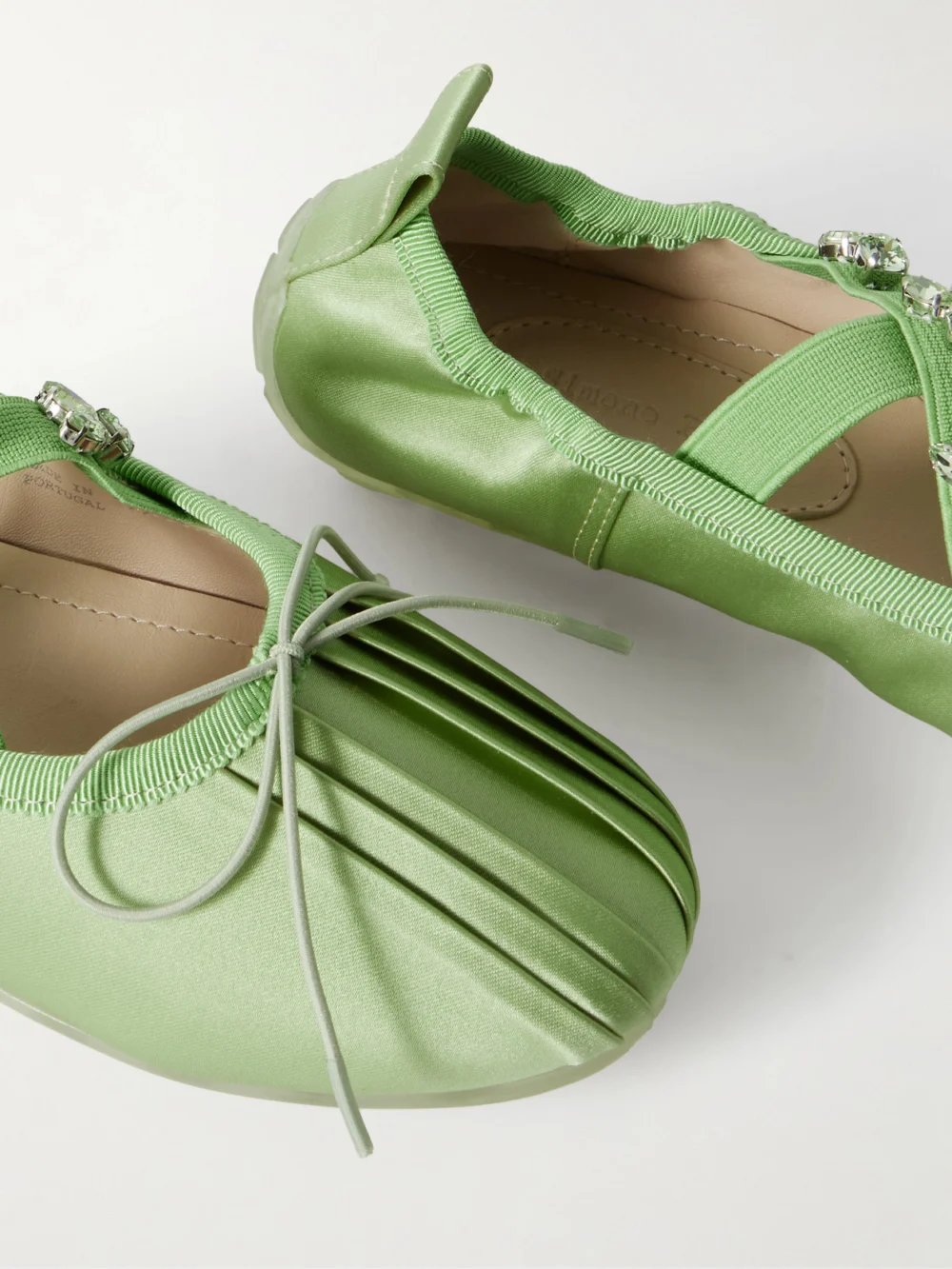 Close-up detail of the Simone Rocha Grosgrain-trimmed Crystal-embellished Pleated Satin Ballet Flats