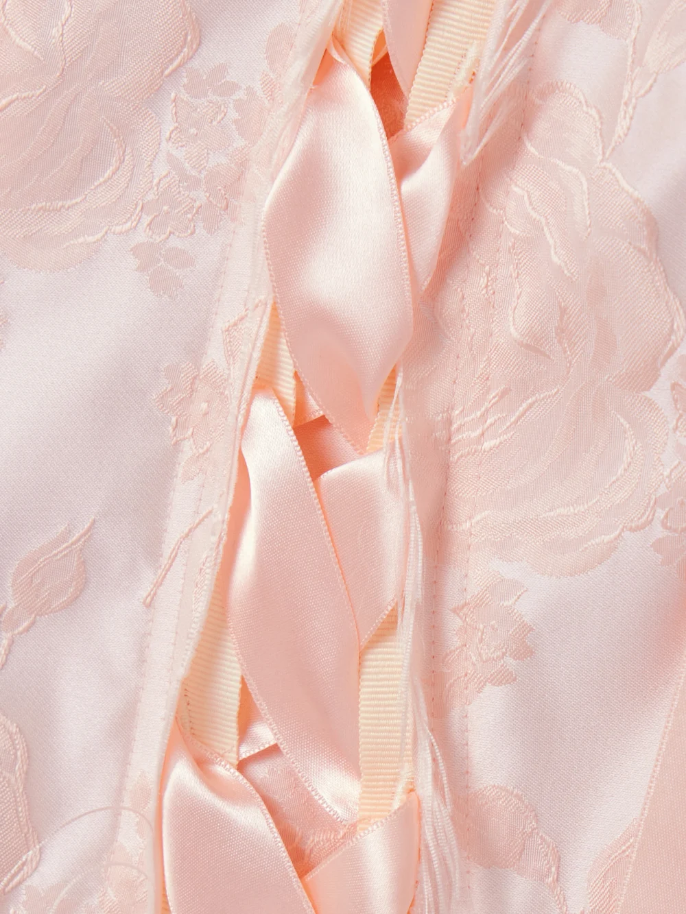 Close-up detail of the Simone Rocha Unraveling Ribbon Lace-up Frayed Brocade Top