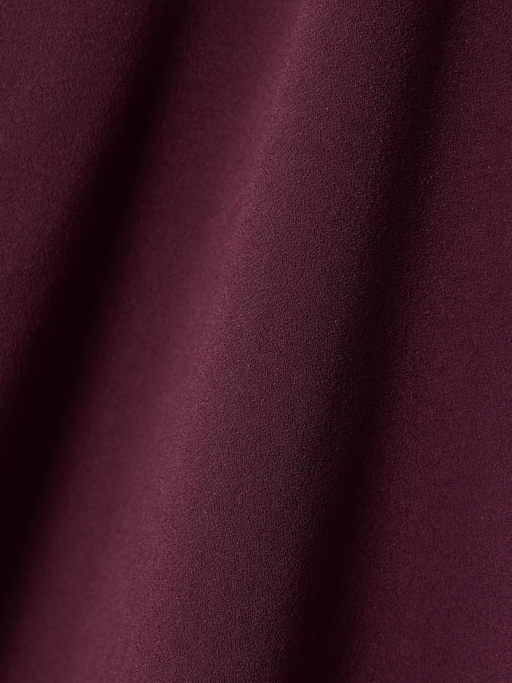 Close-up detail of the Solace London Blake Draped Crepe Gown
