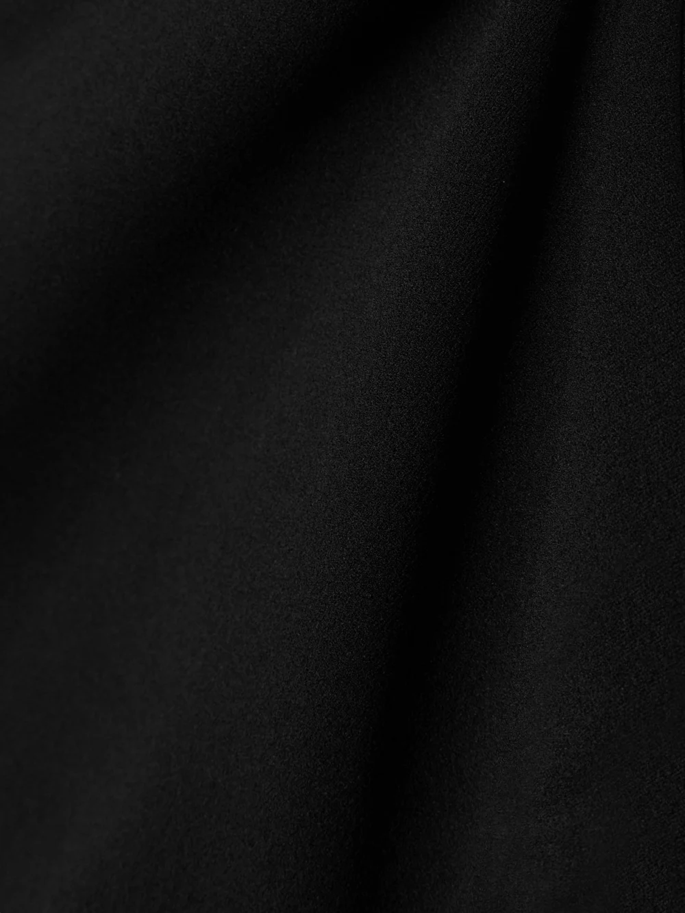 Close-up detail of the Solace London Joana One-sleeve Crepe Gown