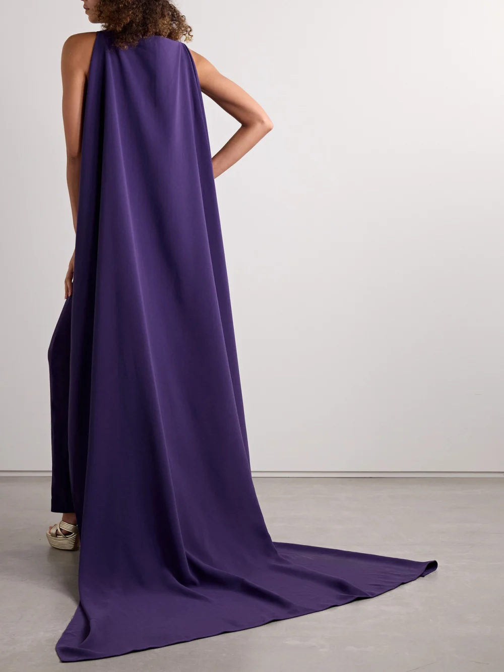 Back view of the Solace London Kaila Cape-effect Crepe Gown