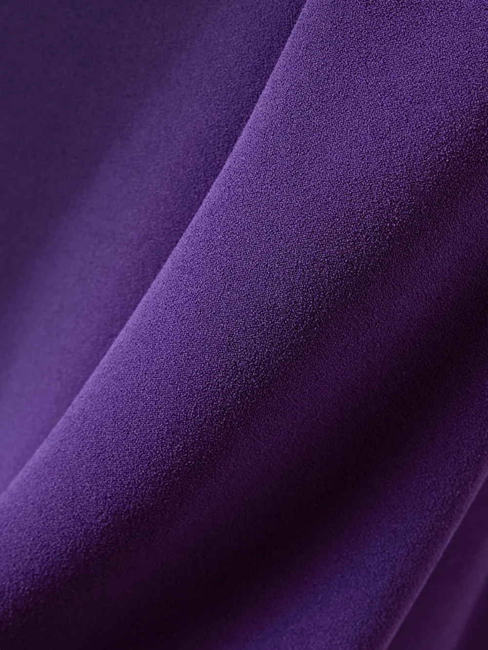 Close-up detail of the Solace London Kaila Cape-effect Crepe Gown