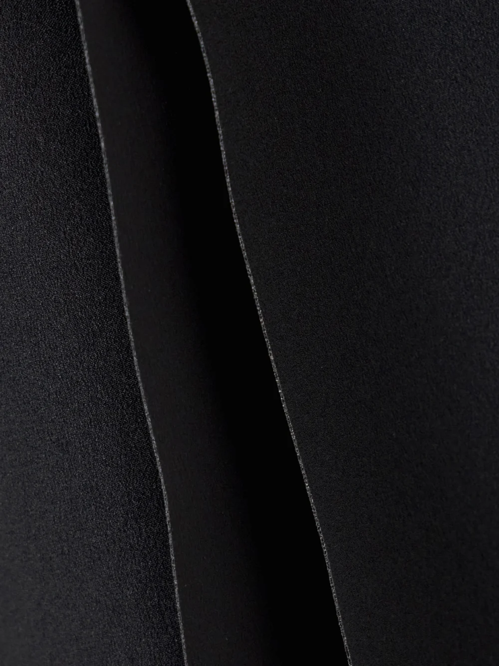 Close-up detail of the Solace London Laurel Crepe Mock-neck Mini Dress