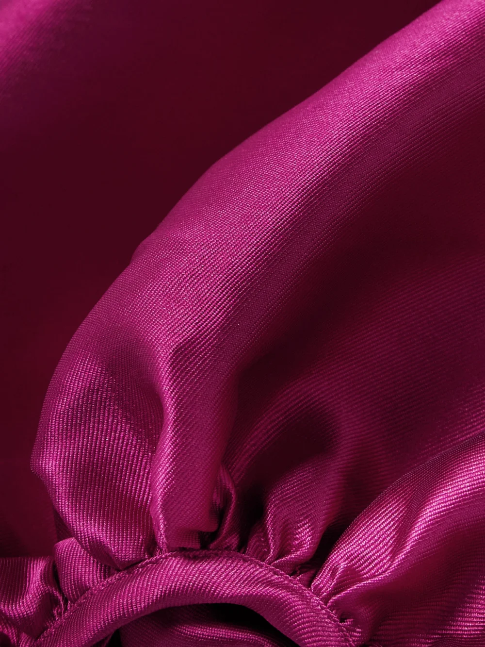 Close-up detail of the Solace London Mora Off-the-shoulder Draped Crepe and Satin-twill Gown