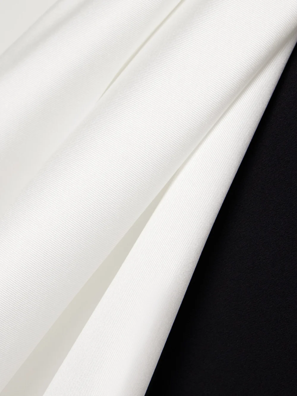 Close-up detail of the Solace London Nala Strapless Crepe and Satin-faille Midi Dress