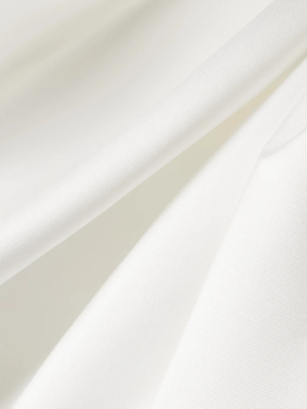 Close-up detail of the Solace London Priya One-shoulder Gathered Satin-twill Gown