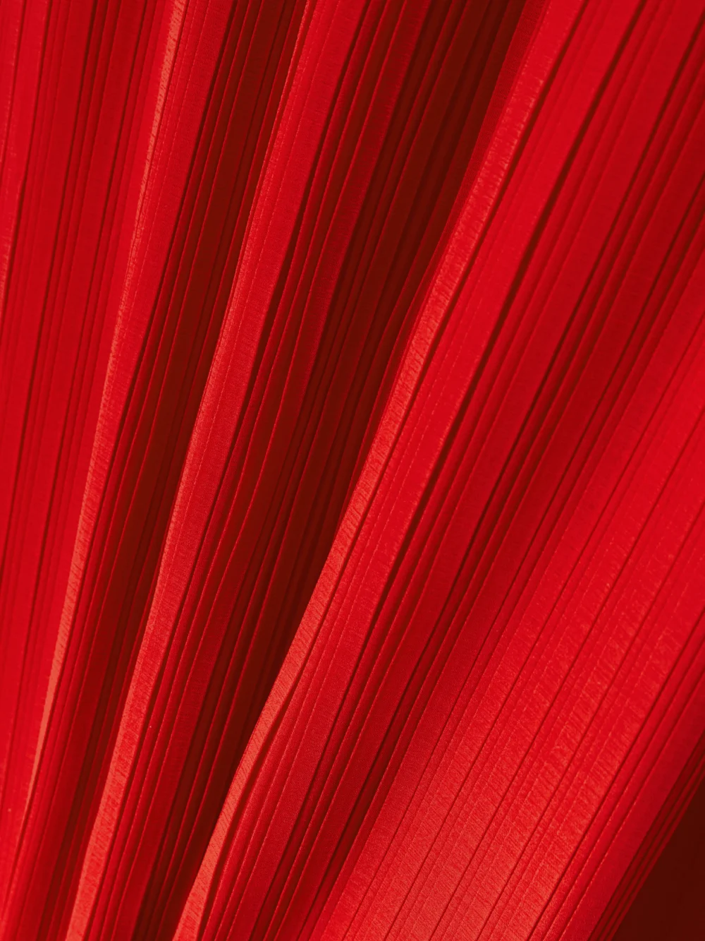 Close-up detail of the Solace London Tavia Cape-effect Pleated Chiffon Gown