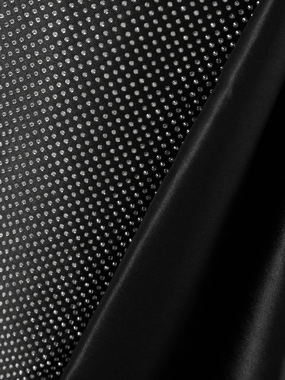 Close-up detail of the Solace London Tiffany Crystal-embellished Strapless Pleated Satin-twill Gown