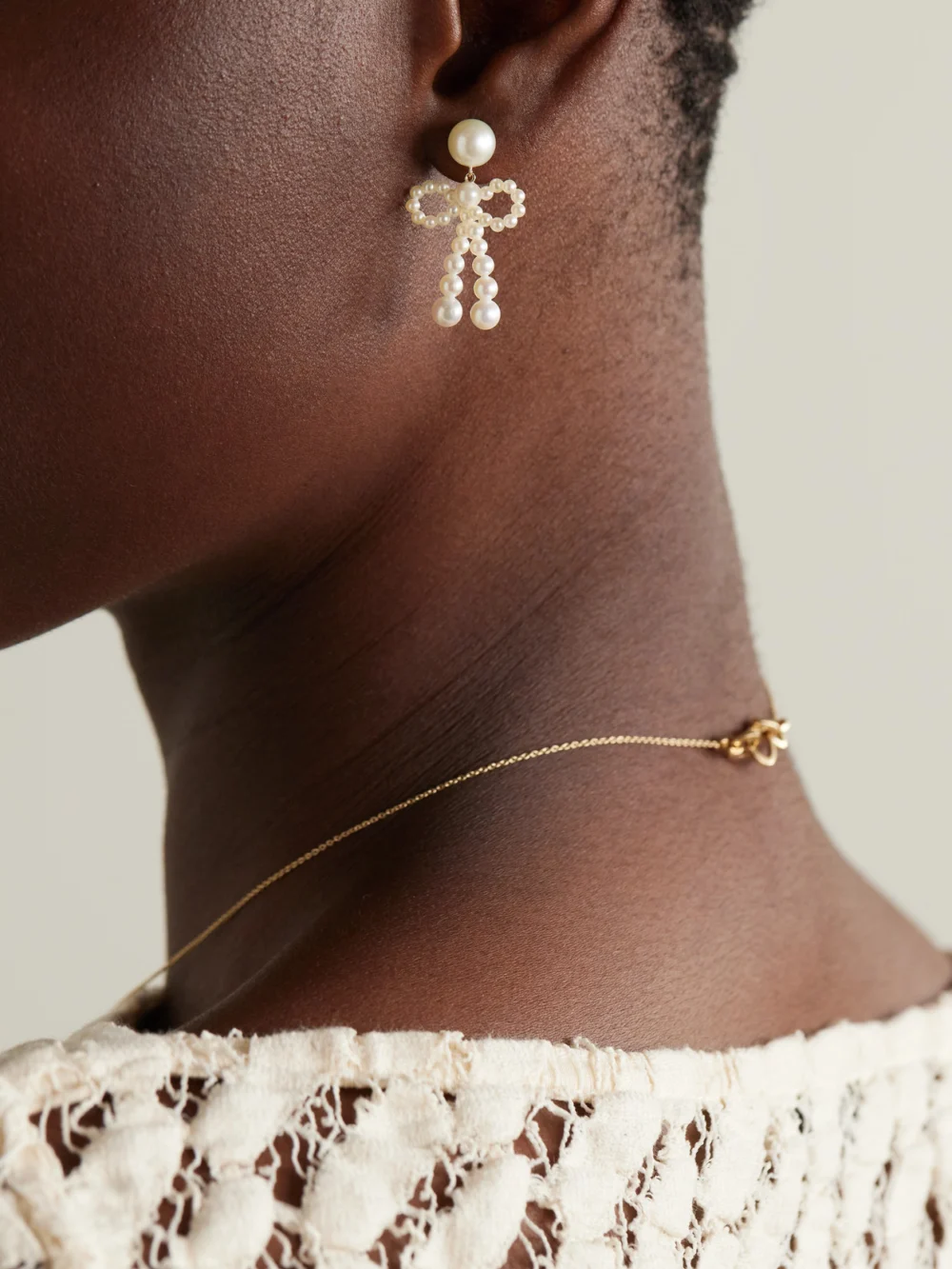 Sophie Bille Brahe Bow 14-karat Recycled Gold Pearl Earrings, styled view