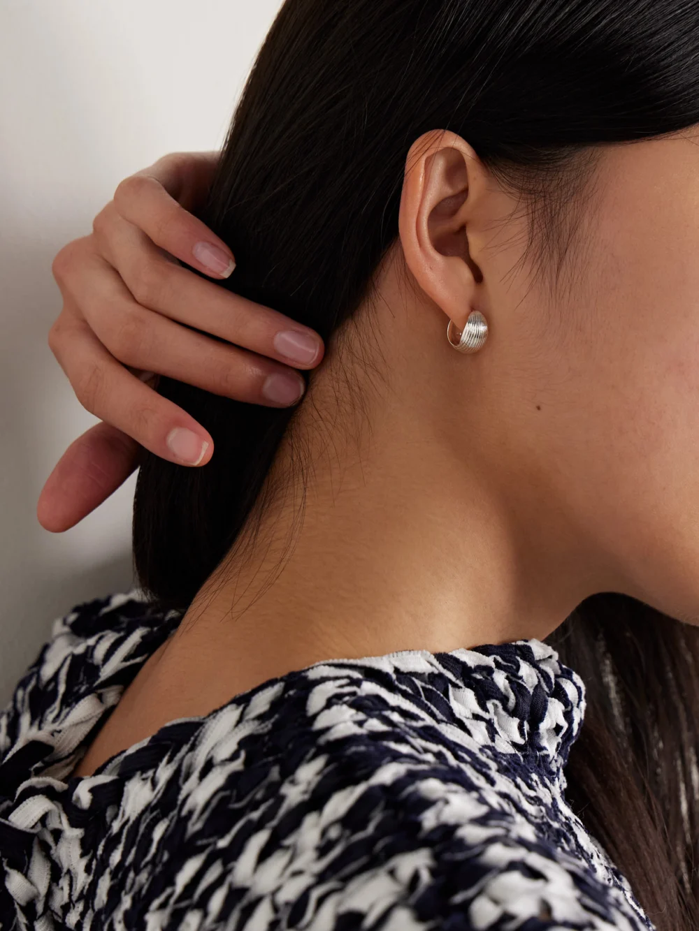 Sophie Buhai Reversible Silver Hoop Earrings, styled view