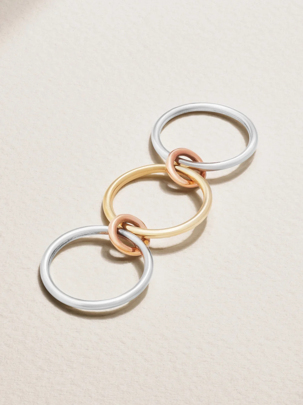 Back view of the Spinelli Kilcollin Solarium Set of Three 18-karat Yellow and Rose Gold and Sterling Silver Rings