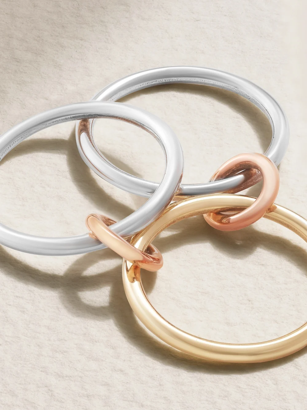 Close-up detail of the Spinelli Kilcollin Solarium Set of Three 18-karat Yellow and Rose Gold and Sterling Silver Rings