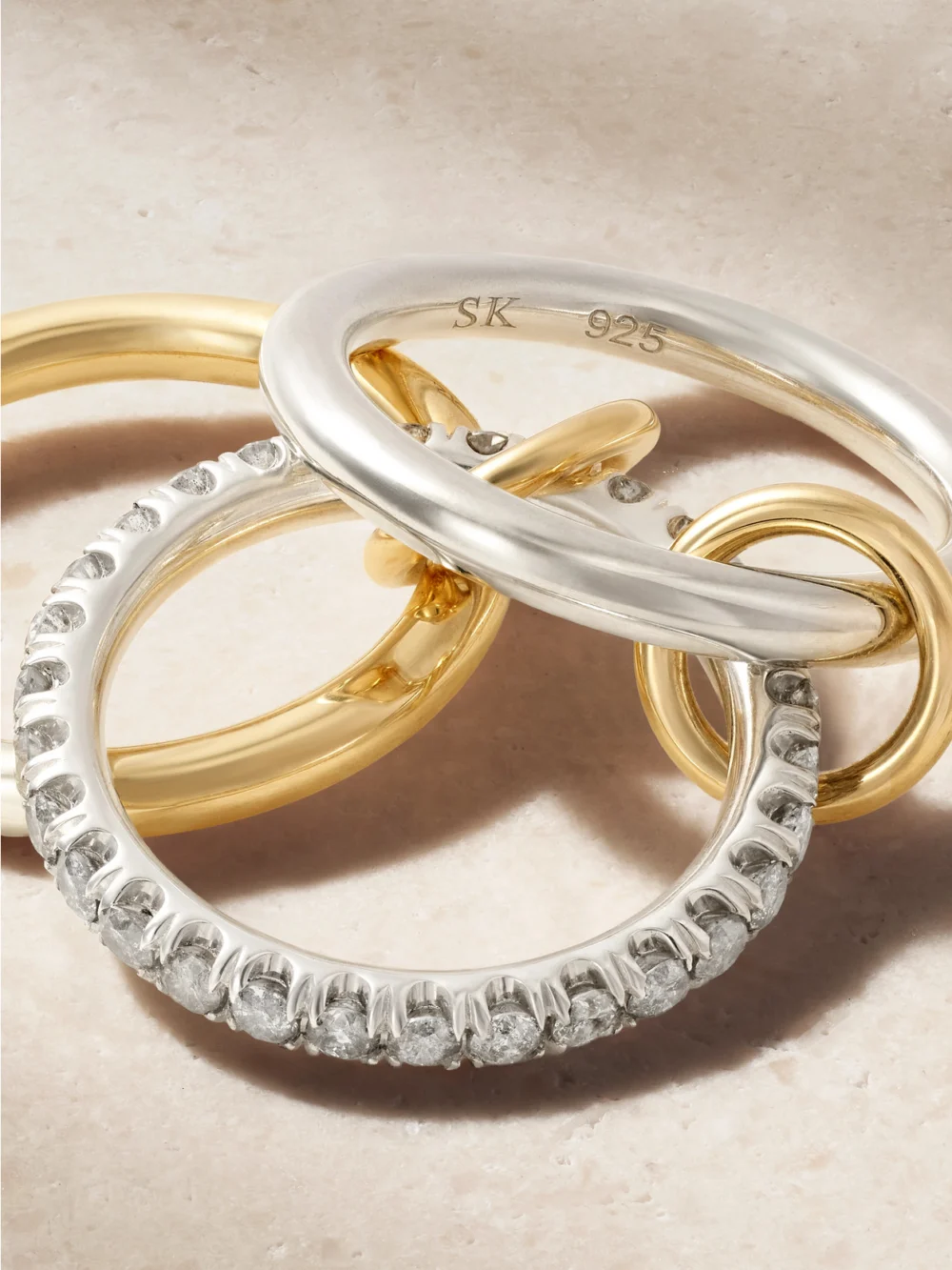 Close-up detail of the Spinelli Kilcollin Taurus Set of Three 18-karat Gold and Sterling Silver Diamond Rings