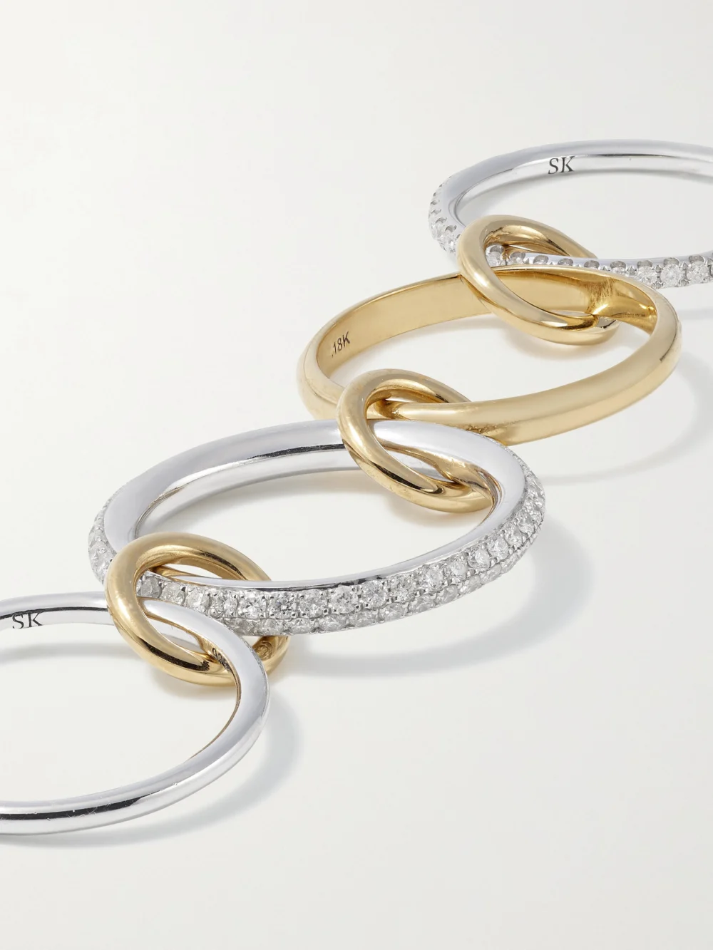 Close-up detail of the Spinelli Kilcollin Vega Set of Four Sterling Silver and 18-karat Gold Diamond Rings