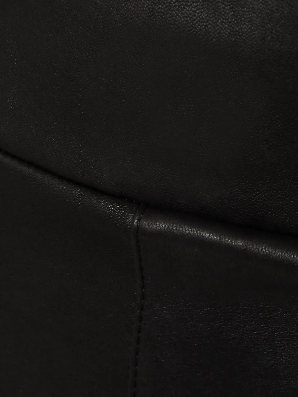 Close-up detail of the Sprwmn Zip-detailed Leather Leggings
