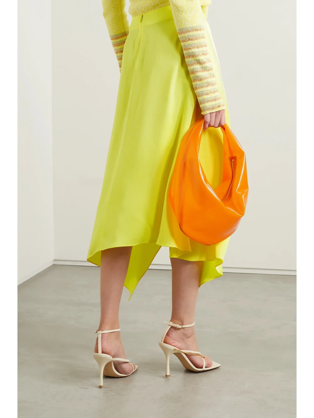 Back view of the Stella McCartney Asymmetric Wrap-effect Satin Midi Skirt