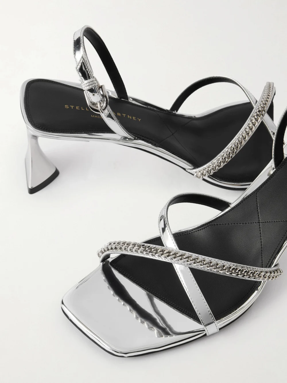 Close-up detail of the Stella McCartney Elsa Embellished Mirrored Slingback Sandals