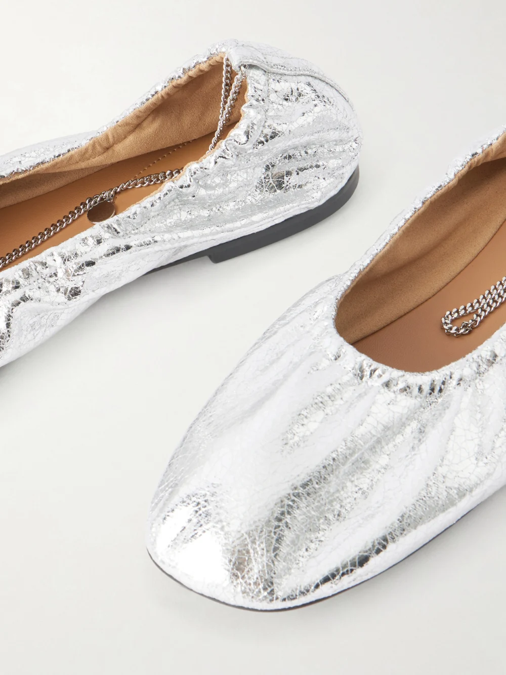 Close-up detail of the Stella McCartney Embellished Crinkled Metallic Flats