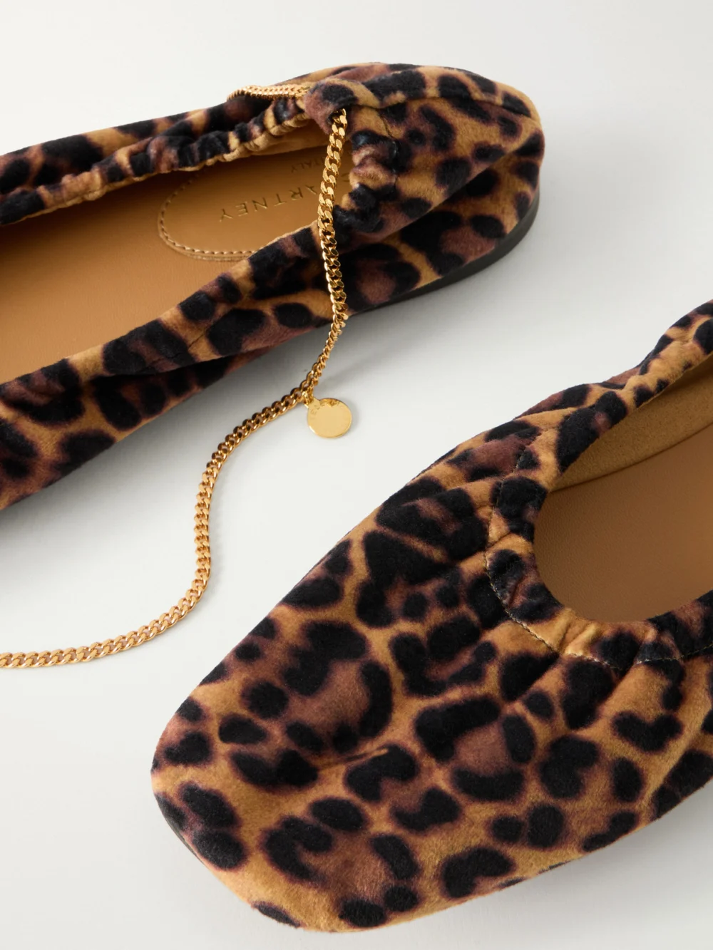 Close-up detail of the Stella McCartney Embellished Leopard-print Velvet Ballerina Flats