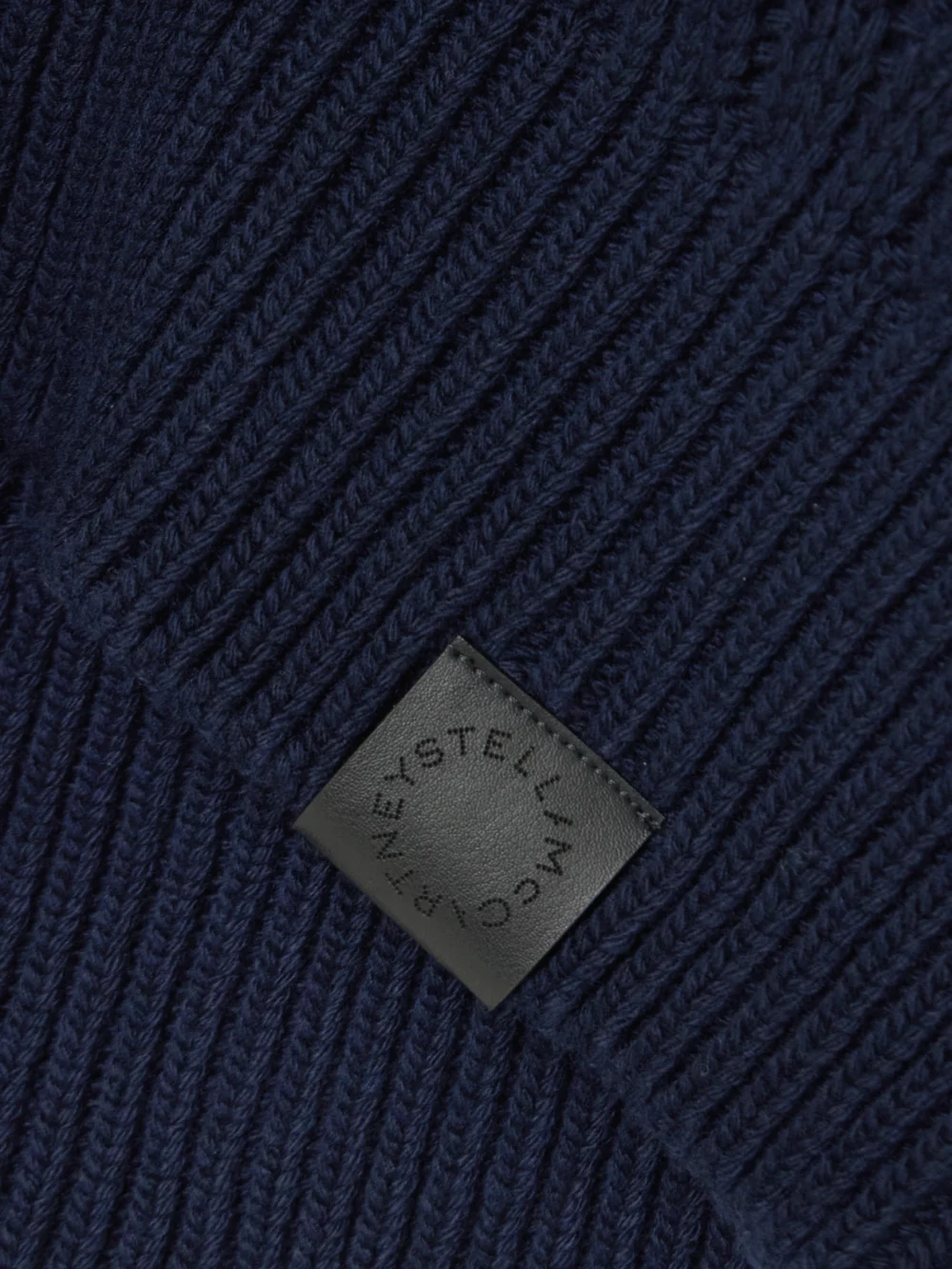 Close-up detail of the Stella McCartney Falabella Cable-knit Wool Sweater