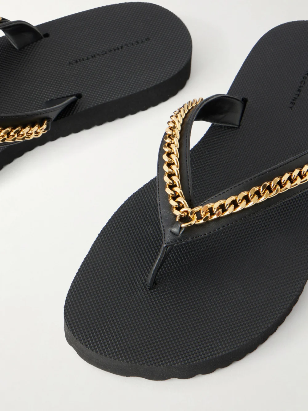 Close-up detail of the Stella McCartney Falabella Embellished Vegetarian Material Flip Flops