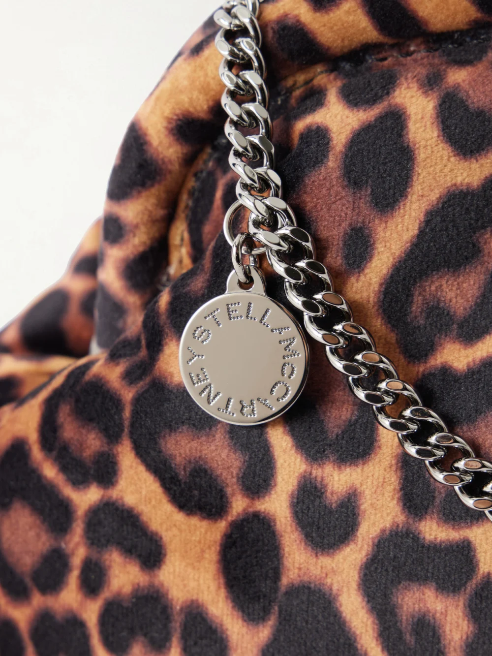 Close-up detail of the Stella McCartney Falabella Leopard-print Velvet Clutch