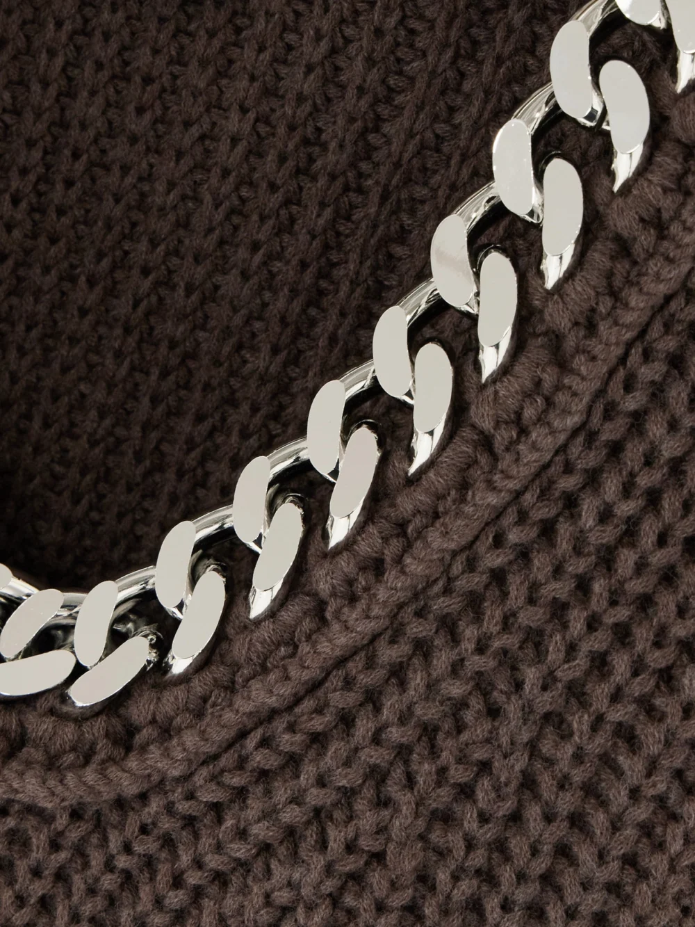 Close-up detail of the Stella McCartney Falabella Oversized Chain-embellished Wool Sweater