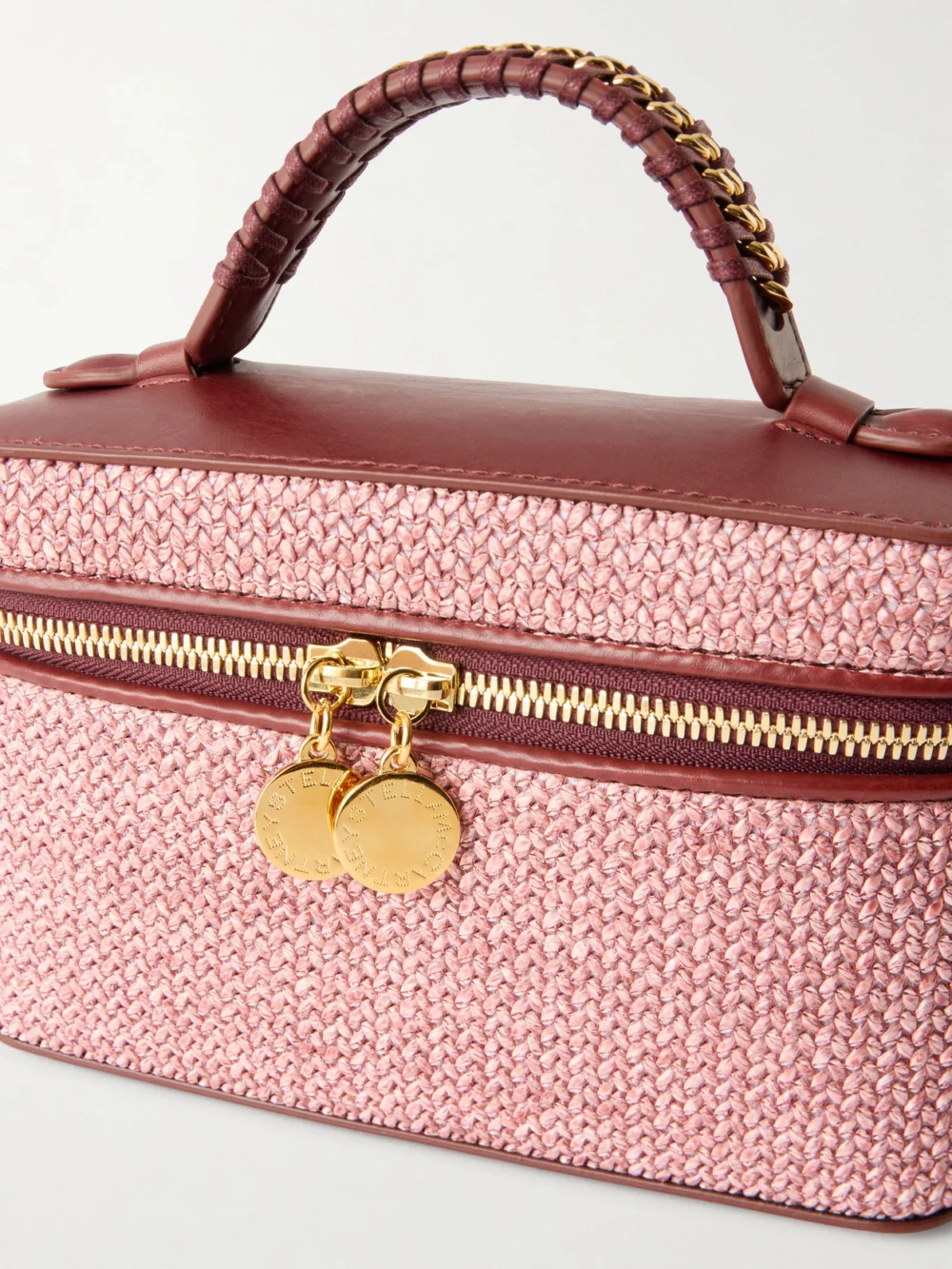 Close-up detail of the Stella McCartney Falabella Vanity Case Vegetarian Material-trimmed Raffia Shoulder Bag