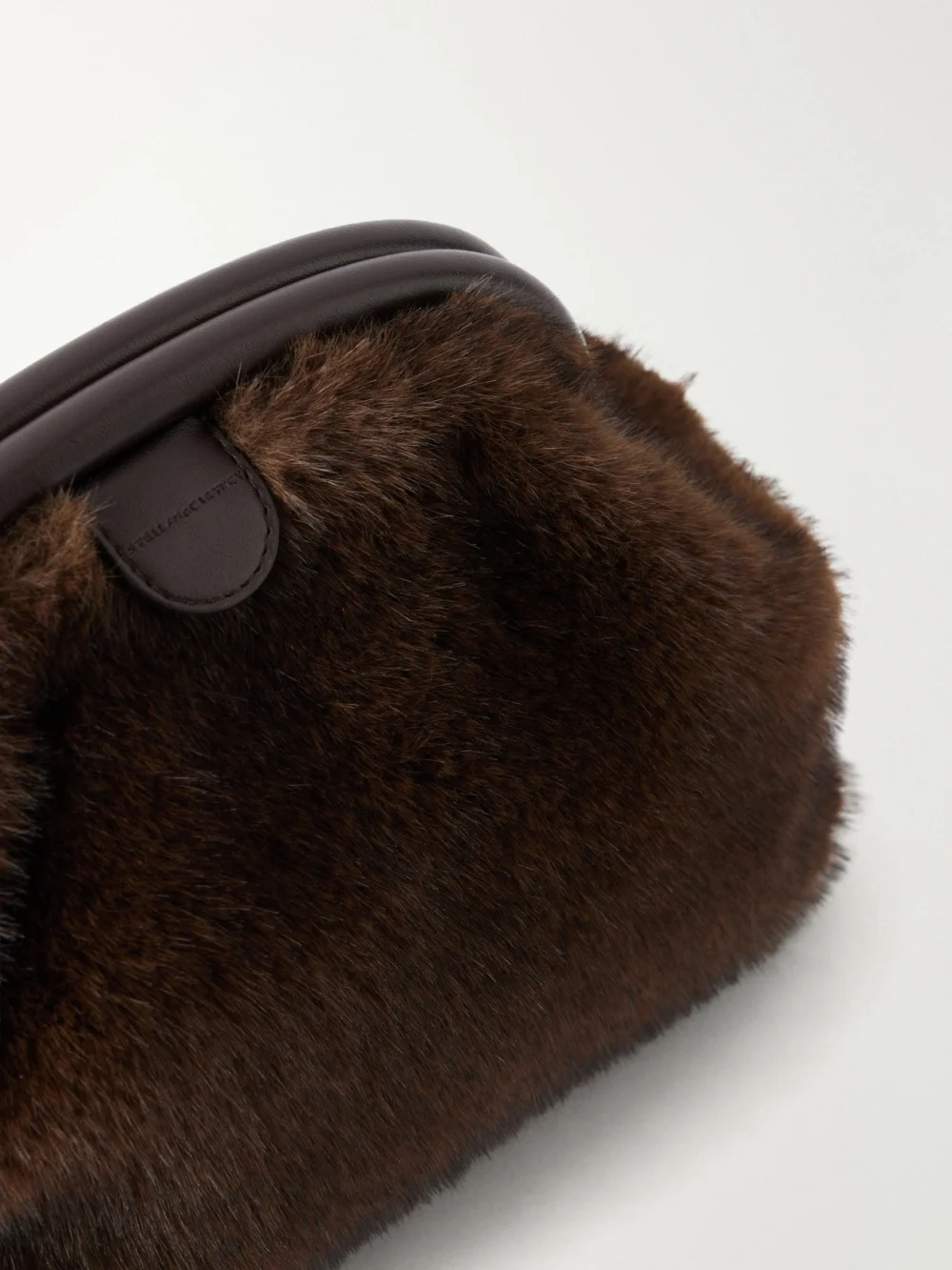 Close-up detail of the Stella McCartney Flabella Plush Clutch Bag